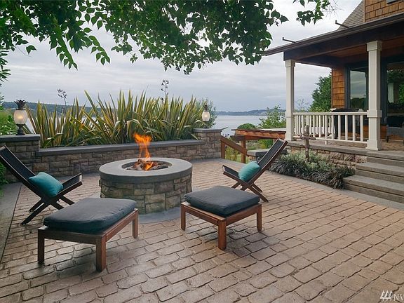 Professionally designed and maintained landscaped grounds with raised gardens for flowers, herbs, and vegetables. In place drip irrigation. Apple trees, fig tree, blueberry bushes, strawberries, and kiwi berry vine.