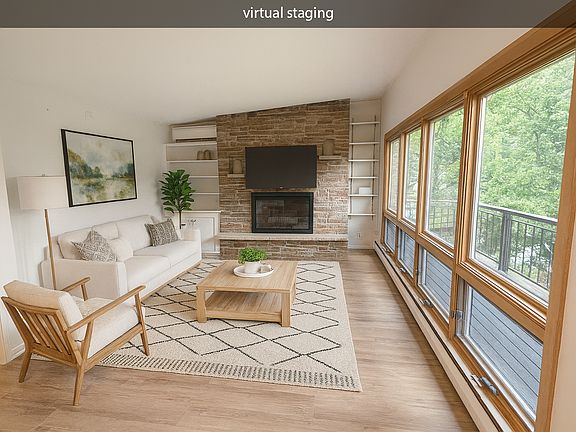 Virtually staged living room showcasing layout potential and natural light.