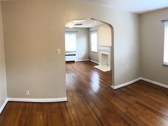 Arched doorways, glass doorkobs, and retro tiles
