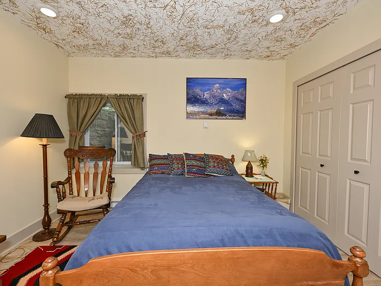 Bunkhouse BR includes large closet with wire drawers for clothes.