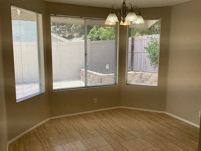 Separate dining room looking out onto the fenced backyard