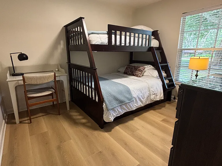 Bedroom #3 with twin over full sized bunk beds and a desk.