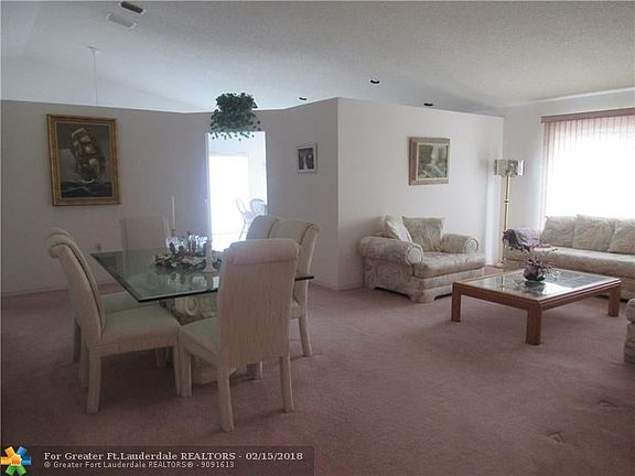 LIVING/DINING AREA - nice and open space with vaulted ceilings and plenty of light.
