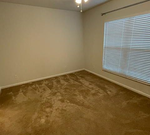 primary bedroom on lower level with ensuite bathroom