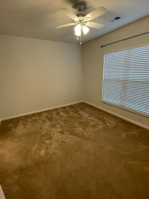 primary bedroom on lower level with ensuite bathroom