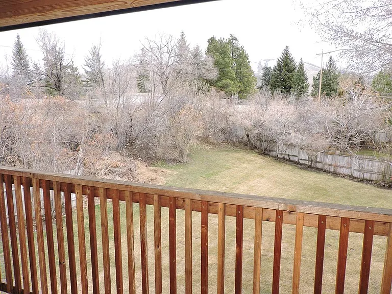 View over backyard from deck off of the master suite, winter