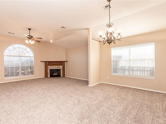 Open Living Area - living room and dining room of 17557 Zinc Dr, Edmond, OK  73012