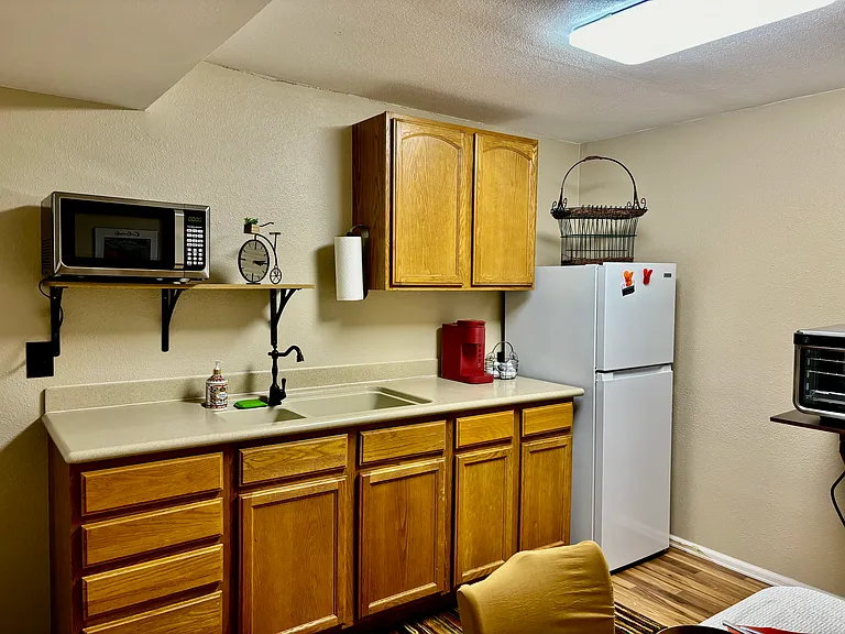 Kitchenette: good size, well-lit, well equipped: Ninja Foodi XL Pro-Air Oven, 2 burners, Microwave, Fridge/Freezer, Keurig, disposal, crockpot, toaster, skillet, pan, etc.