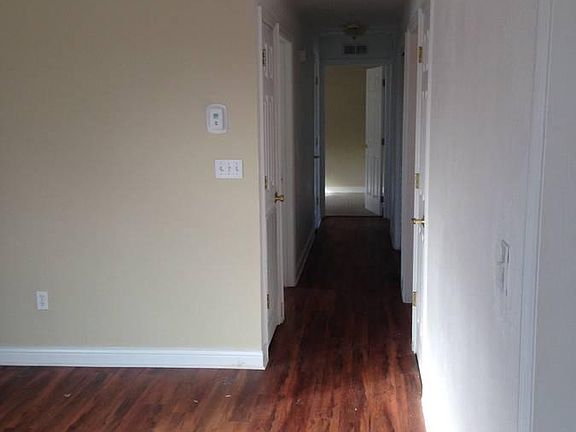 hallway leading from the living room to bedrooms