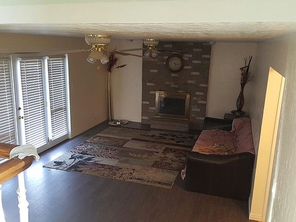 Second living room and door to backyard and garage