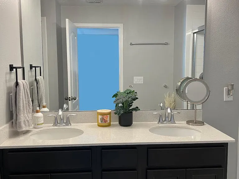 Primary bathroom with updated light fixtures