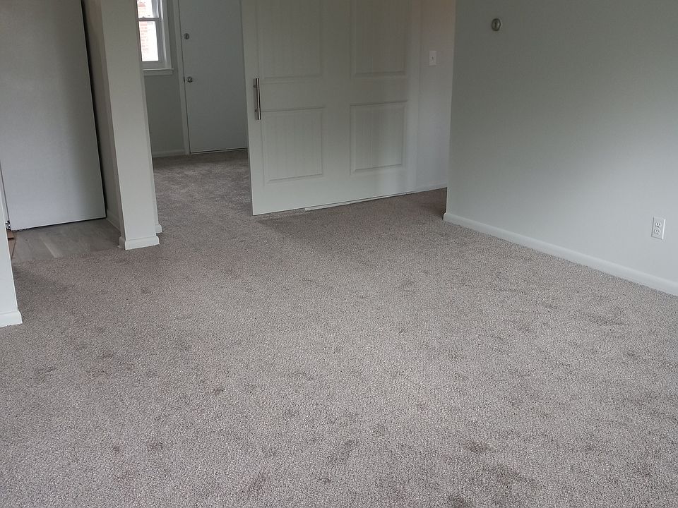 Living room with sliding barn doors to 2nd bedroom / flex room