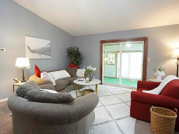 Living room area with vaulted ceiling.