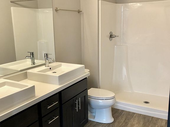 Master bathroom with walk-in shower and double vanity sink