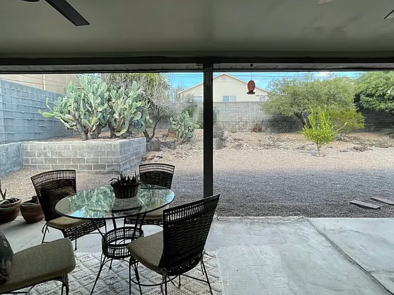 Back patio with two outdoor fans