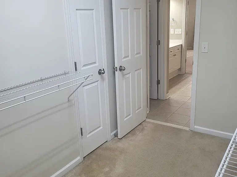Large walk in closets with towel closet into master bathroom