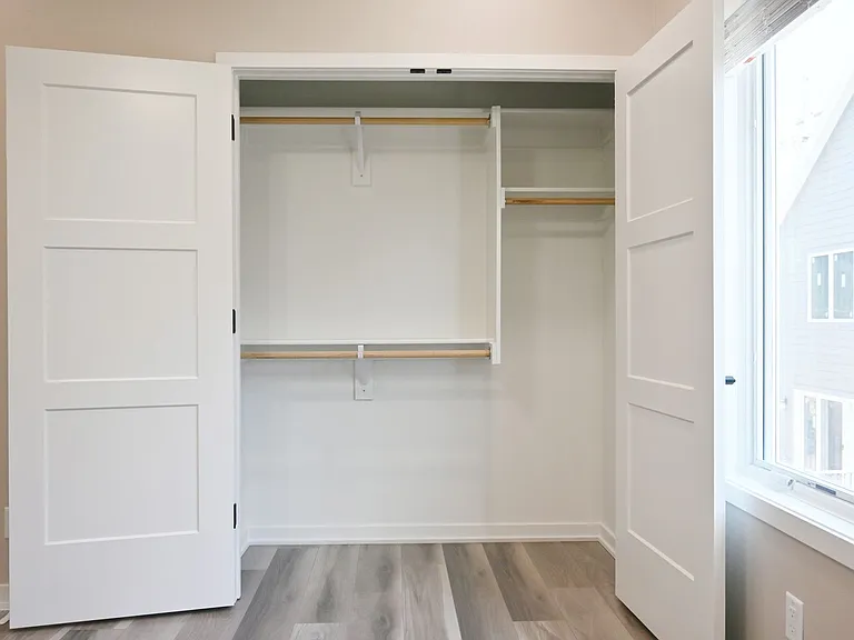 Closet in second bedroom at Lyric Townhomes.