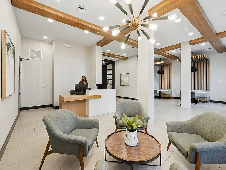 A welcoming lobby sets the tone with contemporary design, warm finishes, and attentive service.
