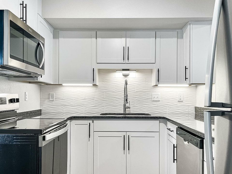 Experience culinary precision in a sleek, modern kitchen designed for efficiency and style.