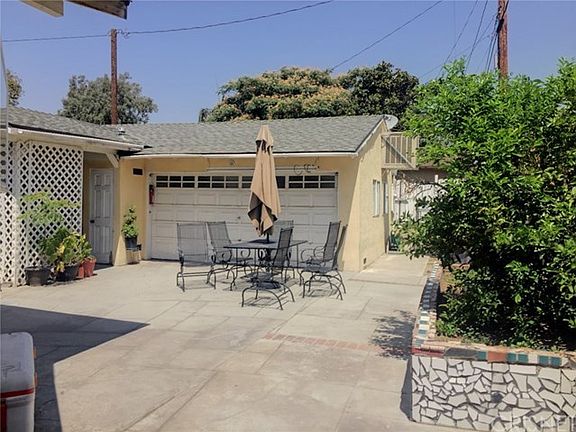 Back yard & garage with permitted room