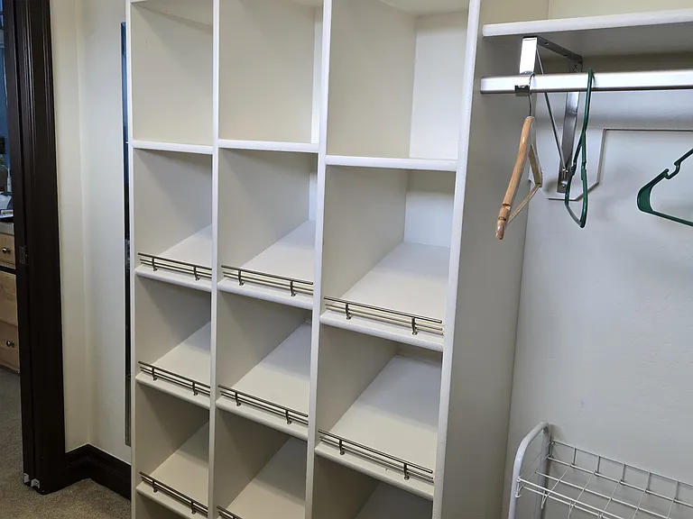 Custom shelves in master bedroom closet