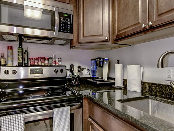 Excellent wood cabinet space and granite counters grace the kitchen!