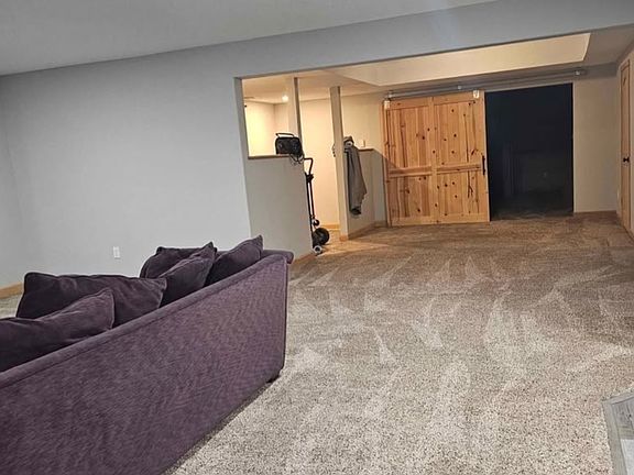 Open living space, view from living room into the other space leading to bedroom and second living space and or sleeping, movie area.