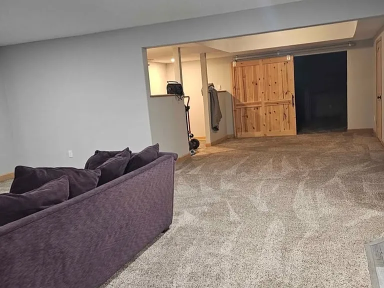 Open living space, view from living room into the other space leading to bedroom and second living space and or sleeping, movie area.
