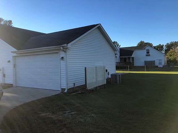 back of house with garage