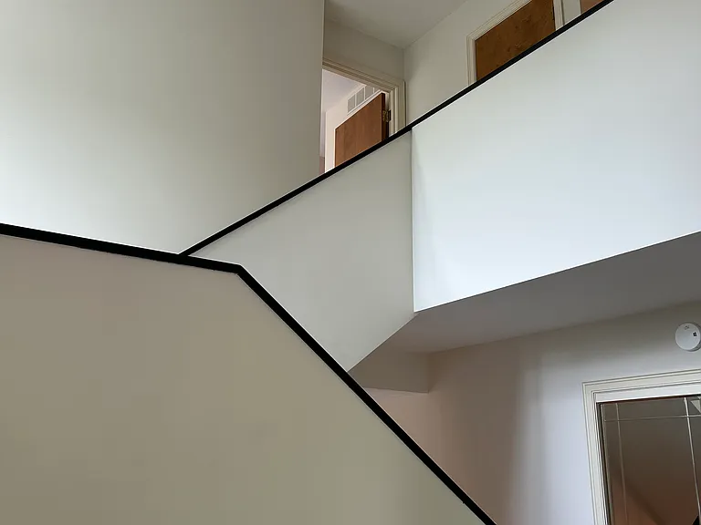 From front door stairway to upstairs