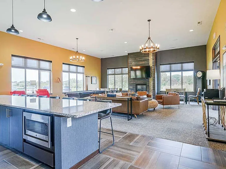 Unwind in our cozy community lounge, complete with stylish seating and TV for your enjoyment.
