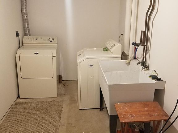 Laundry room includes a washer and dryer.