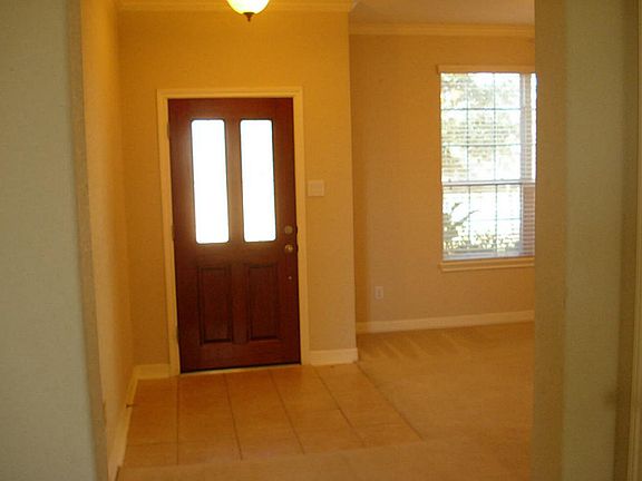 FRONT TILED ENTRY.SHOWING FORMAL DINING.LOTS OS NATURAL LIGHTS