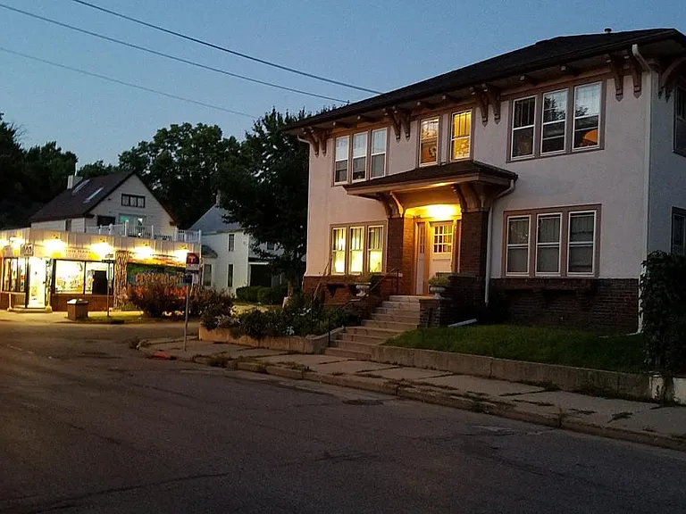 Front of the building at dusk.