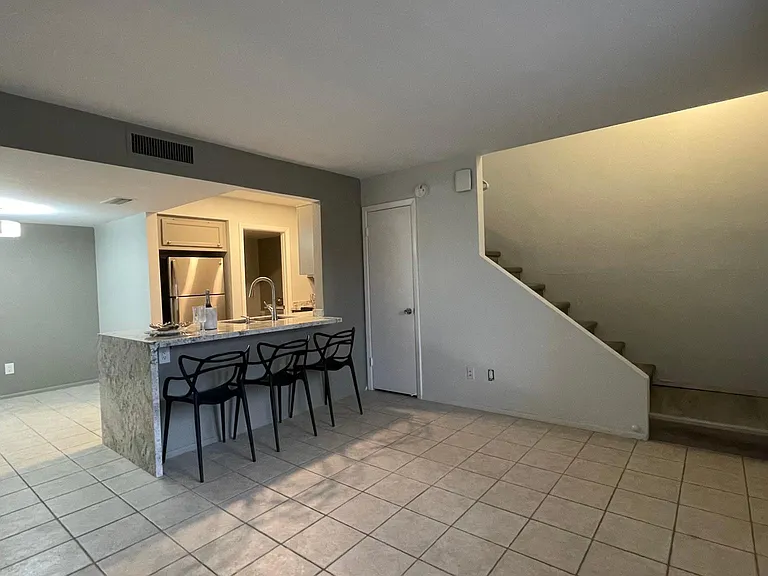 Tile on the first floor for easy maintenance.
Chairs are for staging only.