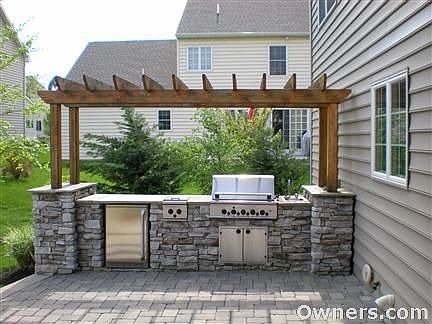 Outdoor Kitchen with Grill, sideburner, and refrigerator