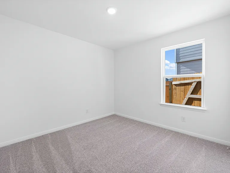 Each bedroom features lush carpet flooring.