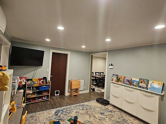 Family room. The door leads to a half bath and laundry room.
