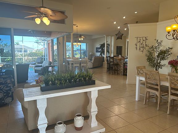 Entryway and dining area looking toward pool and canal