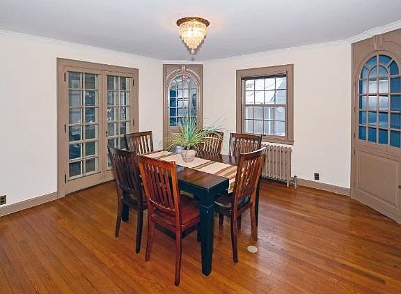 The separate formal dining room is conveniently located directly off the kitchen and is complete with original built in china cabinets.