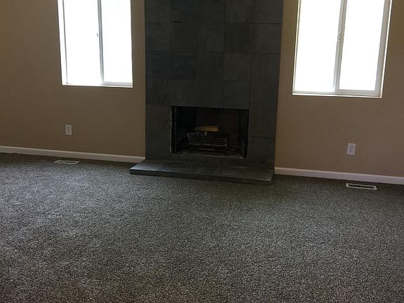 Living Room with Decorative Fireplace