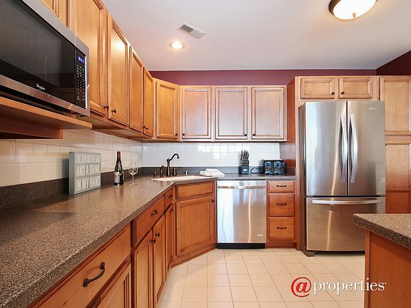 Updated appliances, cabinetry & quartzite counters