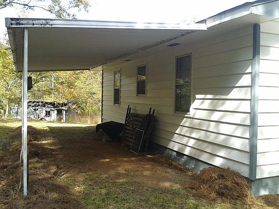 Left side of house and carport