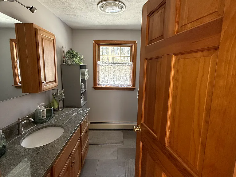 view into bathroom, has tub and shower