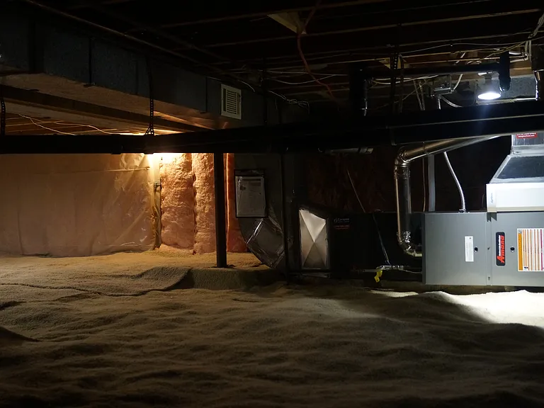New energy efficient Amana heat pump heating and air conditioning system in lighted and carpeted crawl space. Great place to store rarely used items.
