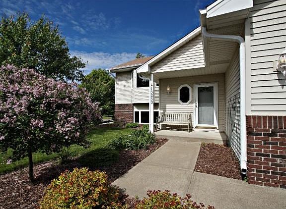 Great walkway to enter the home.  The landscaping is showcased right away!