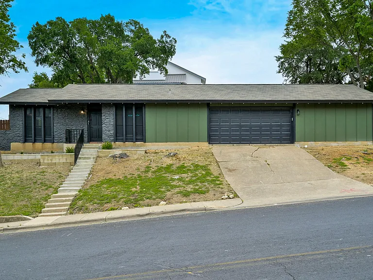 Unit B boasts it's own private entryway along with driveway parking
