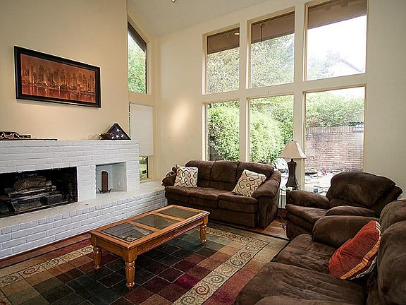 Bright and large downstairs living room with floor to ceiling windows