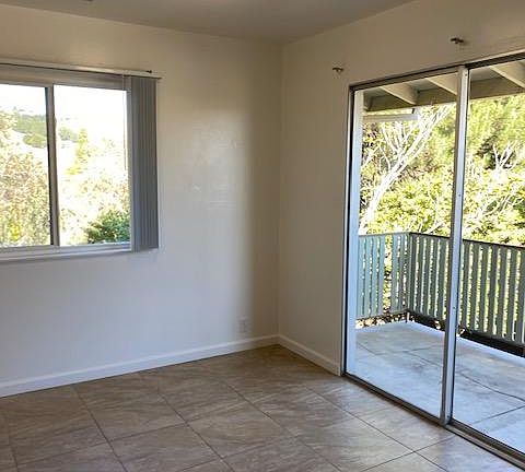 kitchen dinette area with balcony woodsy view