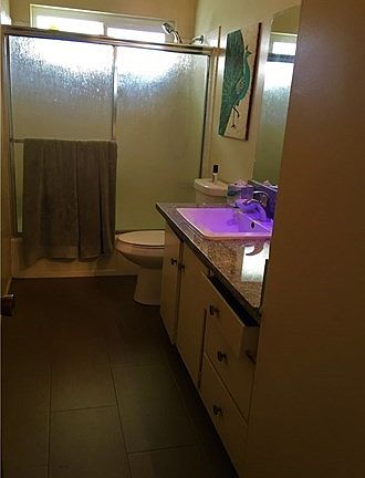 Apartment bathroom with tiled shower